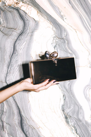 The Brick, gold side, held in hand